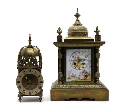 Lot 210 - A brass and porcelain mantel