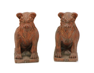 Lot 389 - A pair of faux terracotta seated dogs of Fo