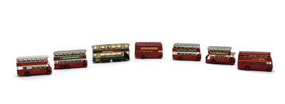 Lot 178 - A collection of fourteen metal model toy buses