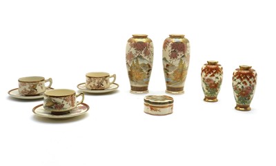 Lot 77 - A set of three Japanese Satsuma ware tea cups and saucers