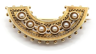 Lot 43 - A Victorian gold pearl set crescent brooch