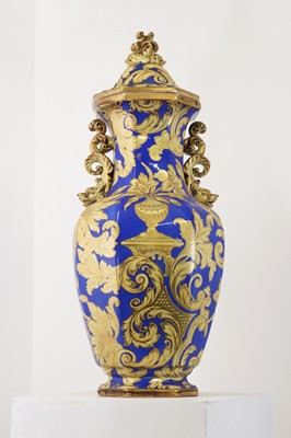 Lot 501 - A large ironstone pottery vase and cover