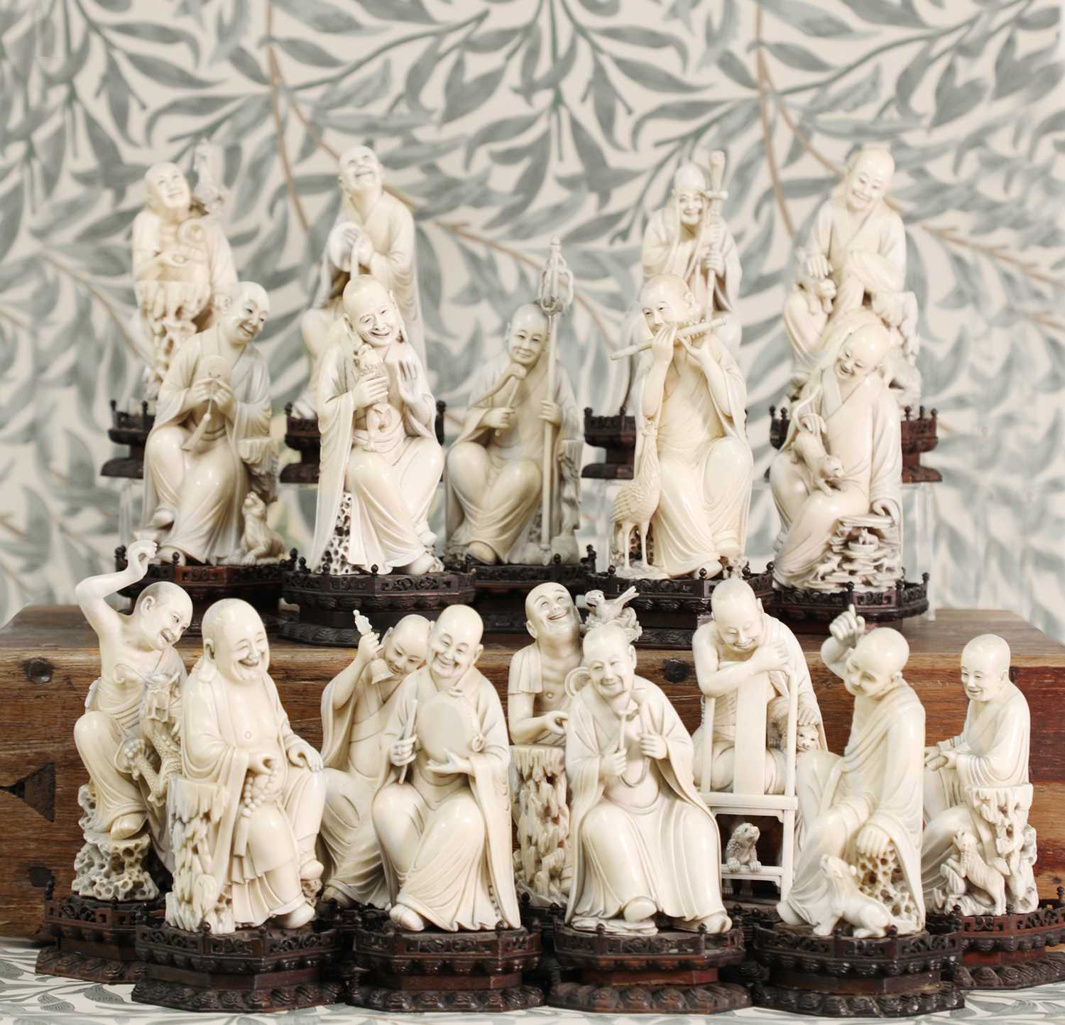 Lot 423 - A set of eighteen carved ivory figures