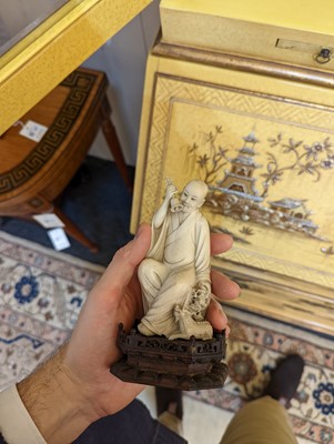Lot 423 - A set of eighteen carved ivory figures