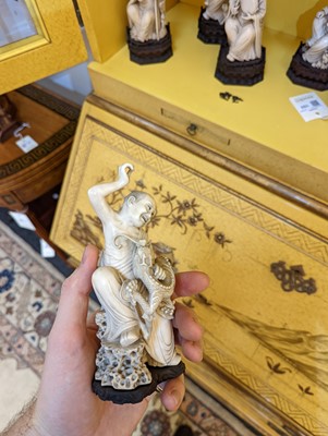 Lot 423 - A set of eighteen carved ivory figures