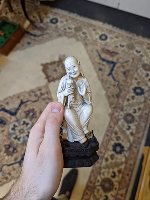Lot 423 - A set of eighteen carved ivory figures
