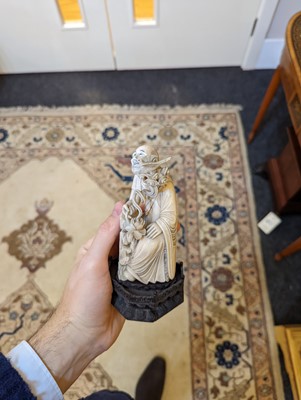 Lot 423 - A set of eighteen carved ivory figures