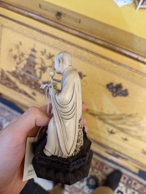 Lot 423 - A set of eighteen carved ivory figures