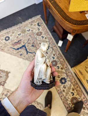 Lot 423 - A set of eighteen carved ivory figures