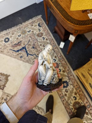 Lot 423 - A set of eighteen carved ivory figures