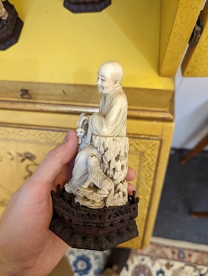Lot 423 - A set of eighteen carved ivory figures