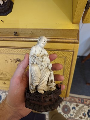 Lot 423 - A set of eighteen carved ivory figures