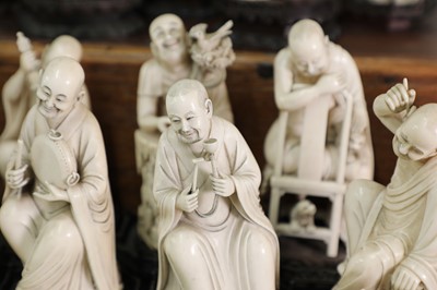 Lot 423 - A set of eighteen carved ivory figures