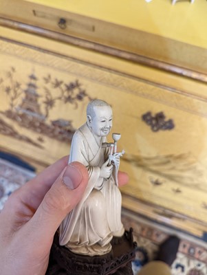 Lot 423 - A set of eighteen carved ivory figures