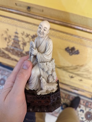 Lot 423 - A set of eighteen carved ivory figures