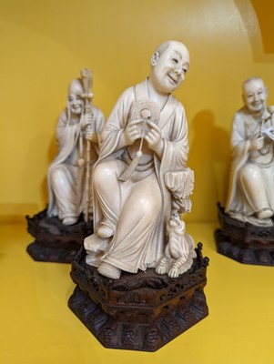 Lot 423 - A set of eighteen carved ivory figures