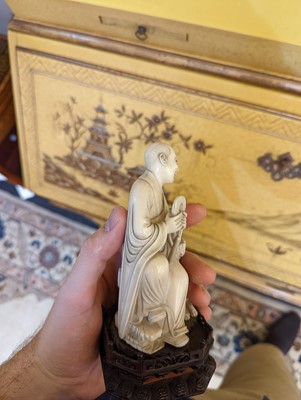 Lot 423 - A set of eighteen carved ivory figures