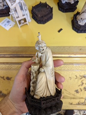 Lot 423 - A set of eighteen carved ivory figures