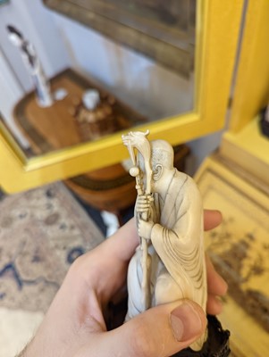 Lot 423 - A set of eighteen carved ivory figures