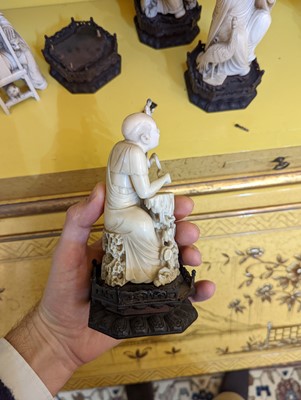 Lot 423 - A set of eighteen carved ivory figures