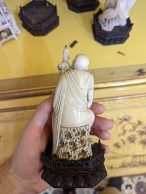 Lot 423 - A set of eighteen carved ivory figures