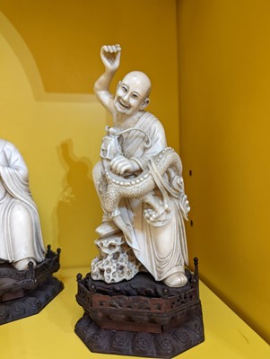 Lot 423 - A set of eighteen carved ivory figures