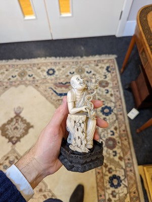 Lot 423 - A set of eighteen carved ivory figures