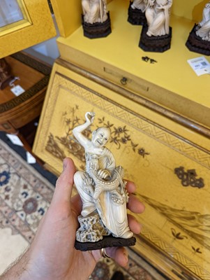 Lot 423 - A set of eighteen carved ivory figures