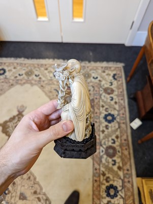 Lot 423 - A set of eighteen carved ivory figures