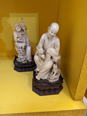 Lot 423 - A set of eighteen carved ivory figures