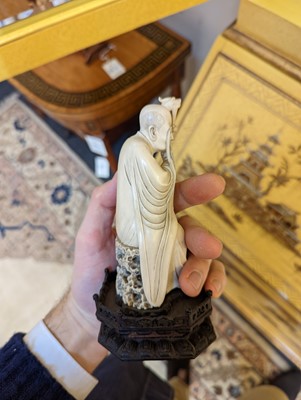 Lot 423 - A set of eighteen carved ivory figures