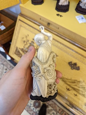 Lot 423 - A set of eighteen carved ivory figures
