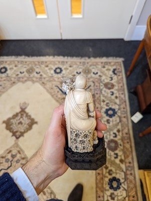 Lot 423 - A set of eighteen carved ivory figures