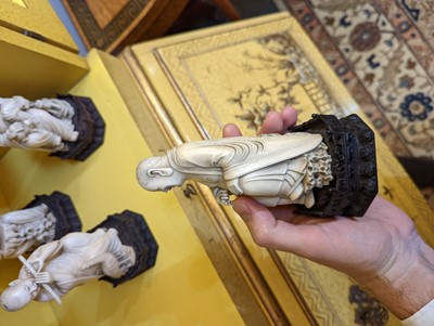 Lot 423 - A set of eighteen carved ivory figures