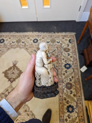 Lot 423 - A set of eighteen carved ivory figures