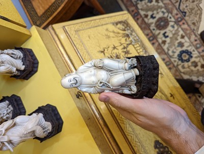 Lot 423 - A set of eighteen carved ivory figures