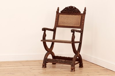 Lot 96 - A carved sandalwood elbow chair