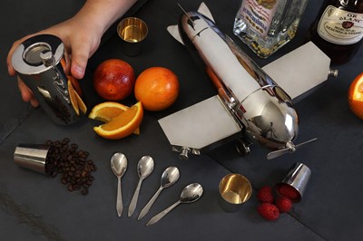 Lot 153 - A novelty silver-plated 'monoplane' travelling bar cocktail set