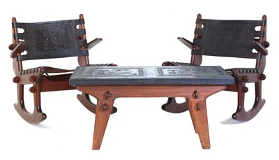 Lot 387 - A pair of teak rocking chairs