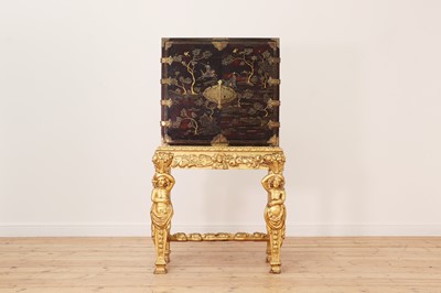 Lot 7 - A lacquered, inlaid and gilt-heightened cabinet on stand