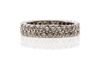 Lot 384 - A two row diamond set full eternity ring