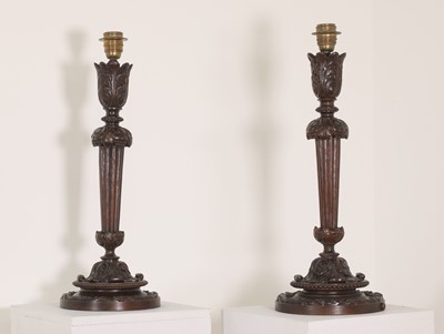 Lot 86 - A pair of Edwardian carved mahogany table lamps