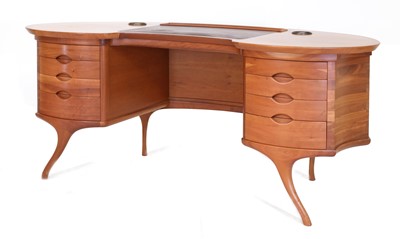 Lot 509 - An Italian 'Bean' American cherrywood desk