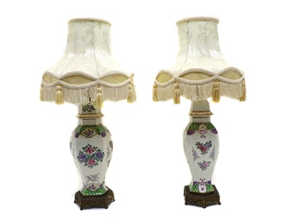 Lot 107 - A pair of porcelain lamps by Samson