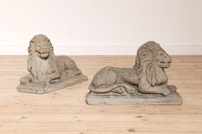 Lot 52 - A pair of reconstituted stone recumbent lions