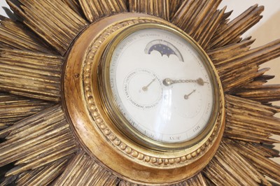 Lot 65 - Sir Noel Coward's wall-mounted sunburst perpetual dial timepiece