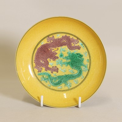 Lot 71 - A Chinese porcelain yellow ground saucer dish