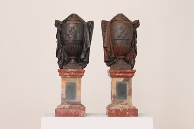 Lot 461 - A pair of neoclassical cast iron urns