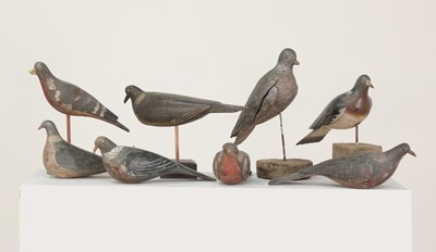 Lot 416 - A flock of carved wooden and painted decoy pigeons