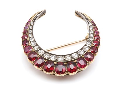 Lot 51 - A Victorian ruby and diamond closed crescent brooch, c.1890
